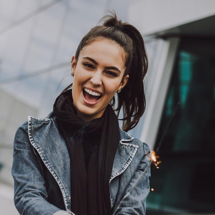 Ava Singh, Lead Design Curator at Integrated Connect Space, reviewing corporate floral arrangements